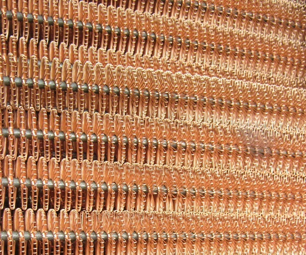 Photo of many turbulator inserts - These are steel core with copper wire windings